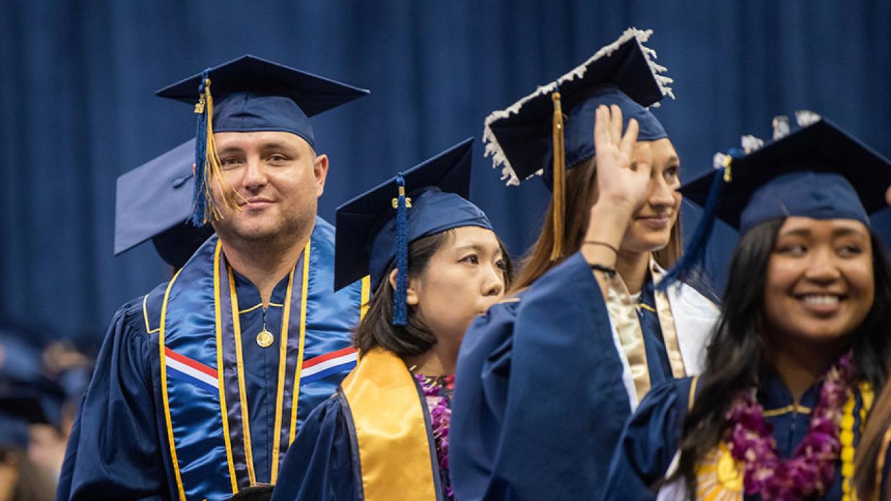 Four students at commencement