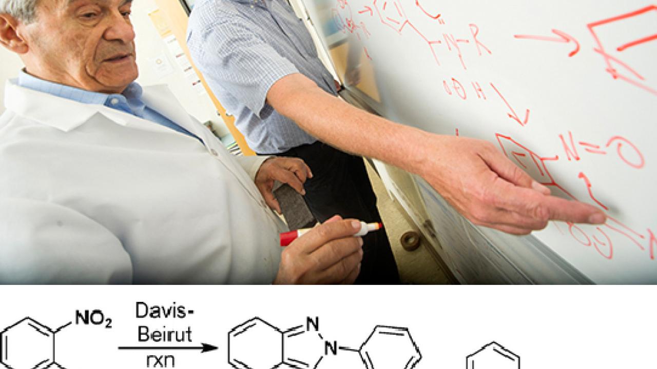 Photo and graphic: Professors Makhluf Haddadin and Mark Kurth at whiteboard, working on a formula
