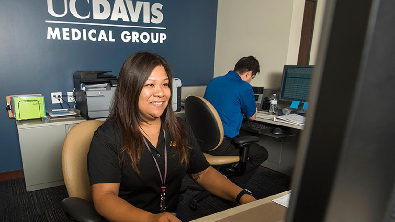 Photo: Jo Ena Christensen and Hugo Casillas Jimenez behind the counter at the Davis Clinic