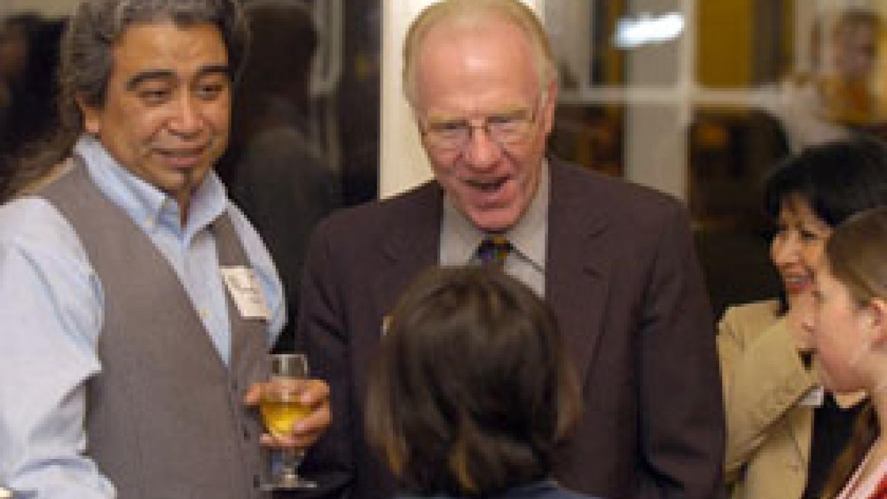 Award recipient Joaquin Galvan and Chancellor Larry Vanderhoef enjoy a laugh with Galvan&rsquo;s grandchildren during a reception for the Chancellor&rsquo;s Achievement Awards for Diversity and Community. 