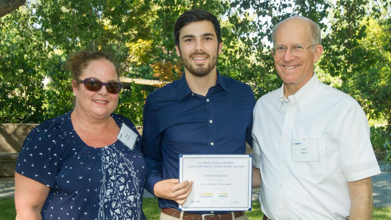 Laurie Vazquez, son Eliseo Vazquez and Ken Burtis, certificate presentation