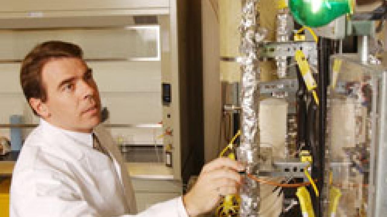 photo of Paul Erickson working in his lab coat