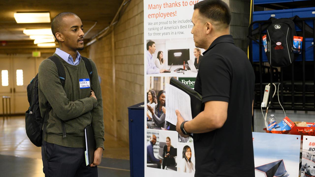 Student talks to recruiter.