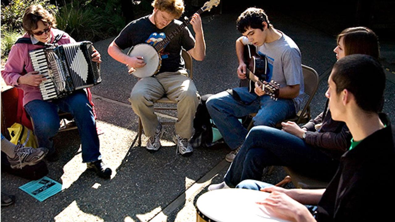 Photo: Playing the accordion, Elaine Fingerett, the arboretum's academic coordinator, joins unidentified undergraduates in Folk Music Jam Session.