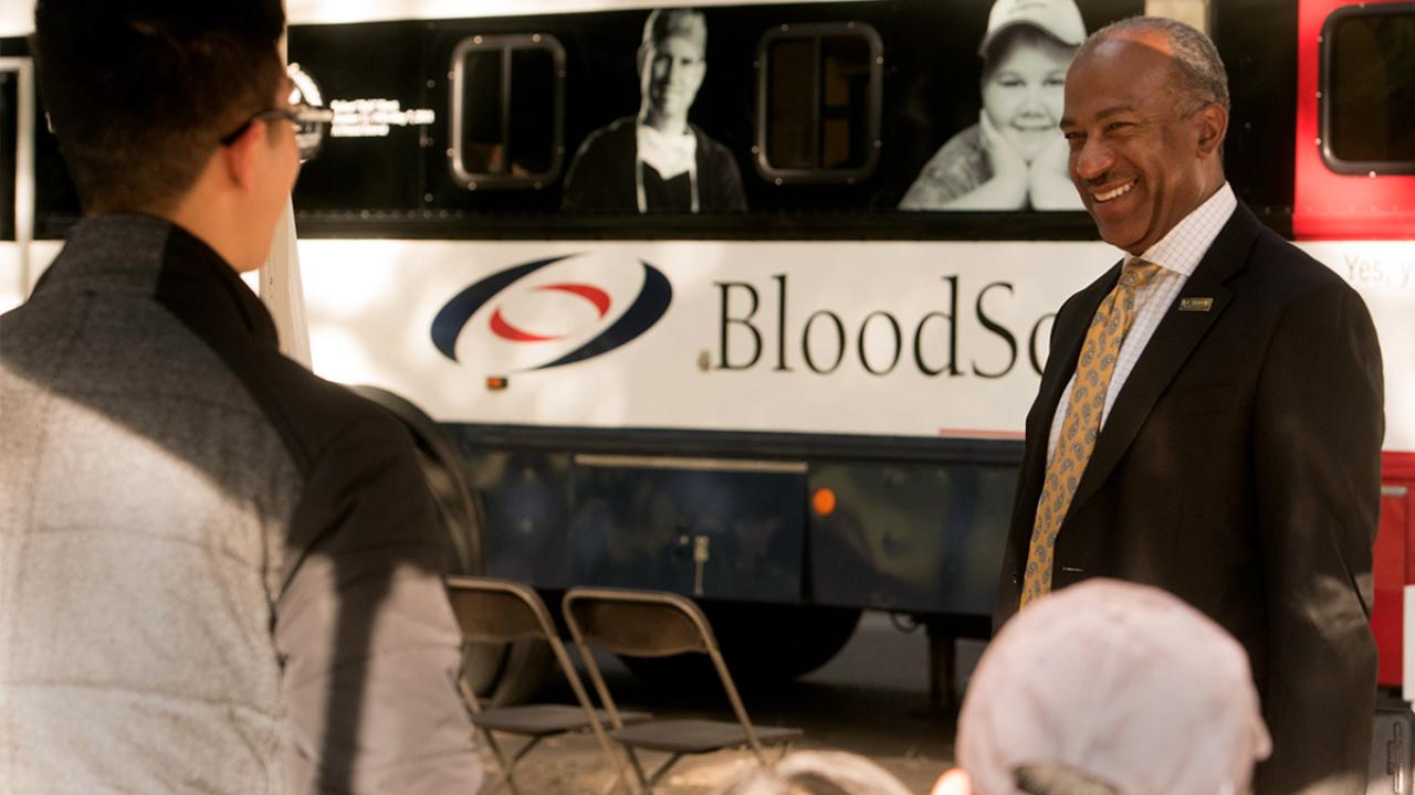 Chancellor Gary S. May visits the blood drive.