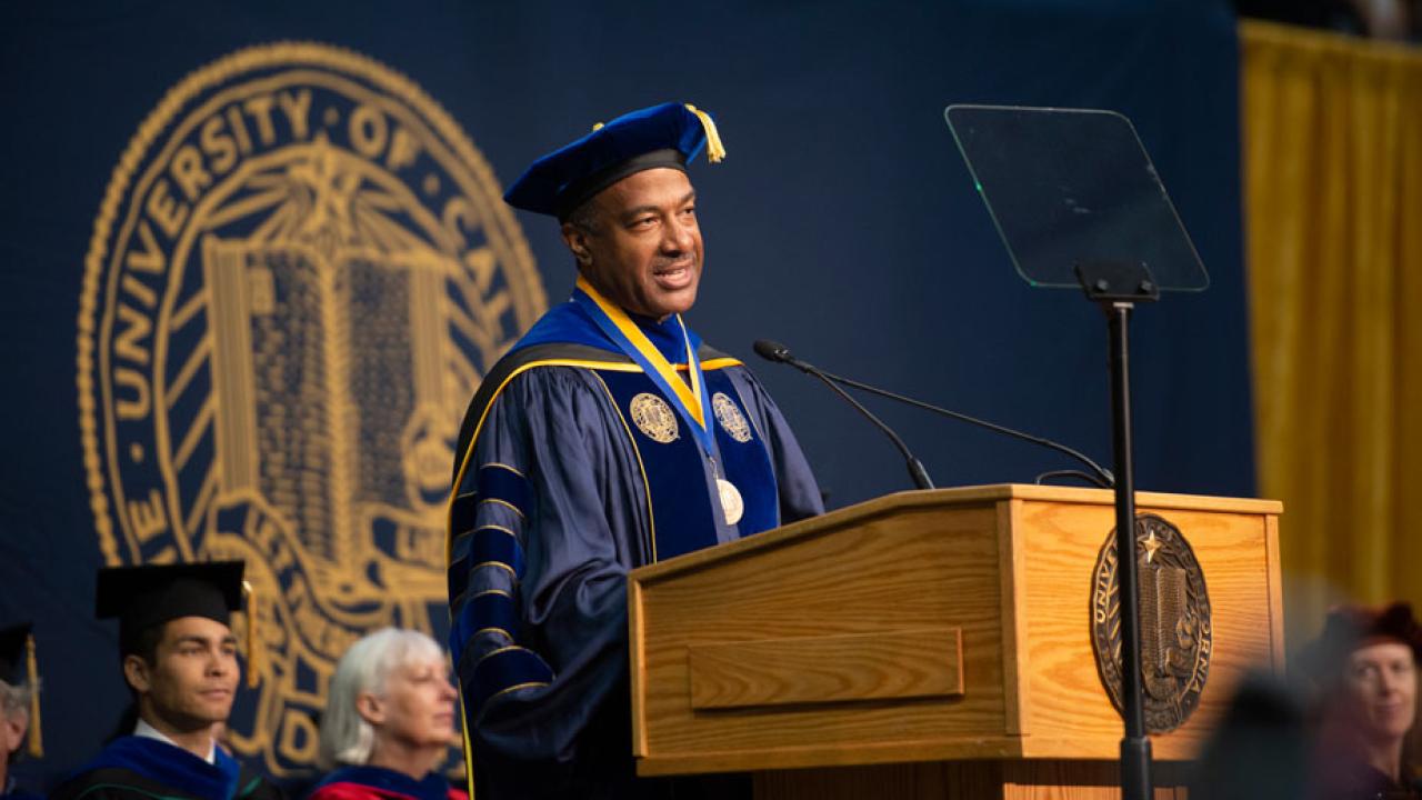 Chancellor Gary S. May in commencement regalia, speaking at commencement.