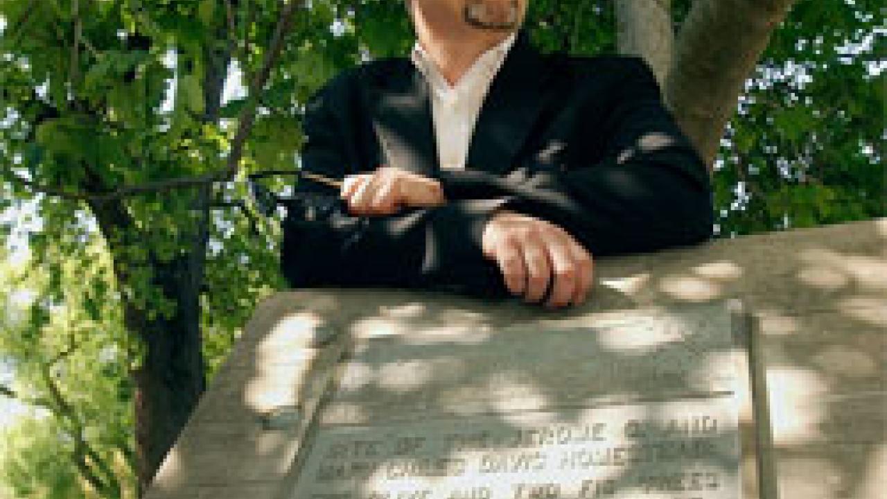Grounds Division Director Sal Genito is shown by fig trees that began life on the old Mary Chiles Davis homestead &mdash; but are now surrounded by Sproul Hall.
