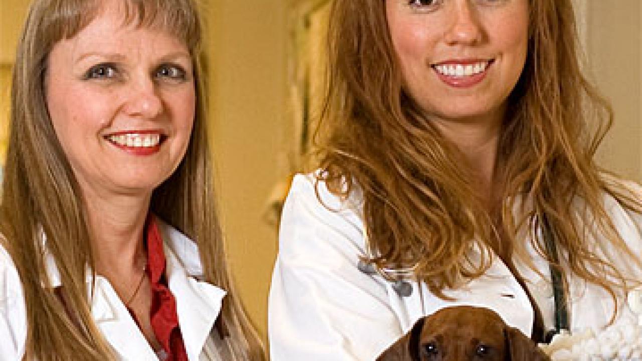 Photo: Sharon Hunt Gerardo, left, and daughter Angelina Gerardo posing with a dachshund