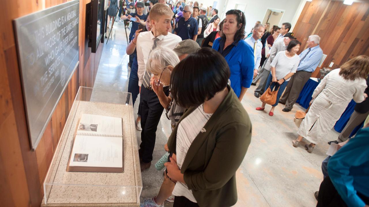 People look at the Golden Memory Book.