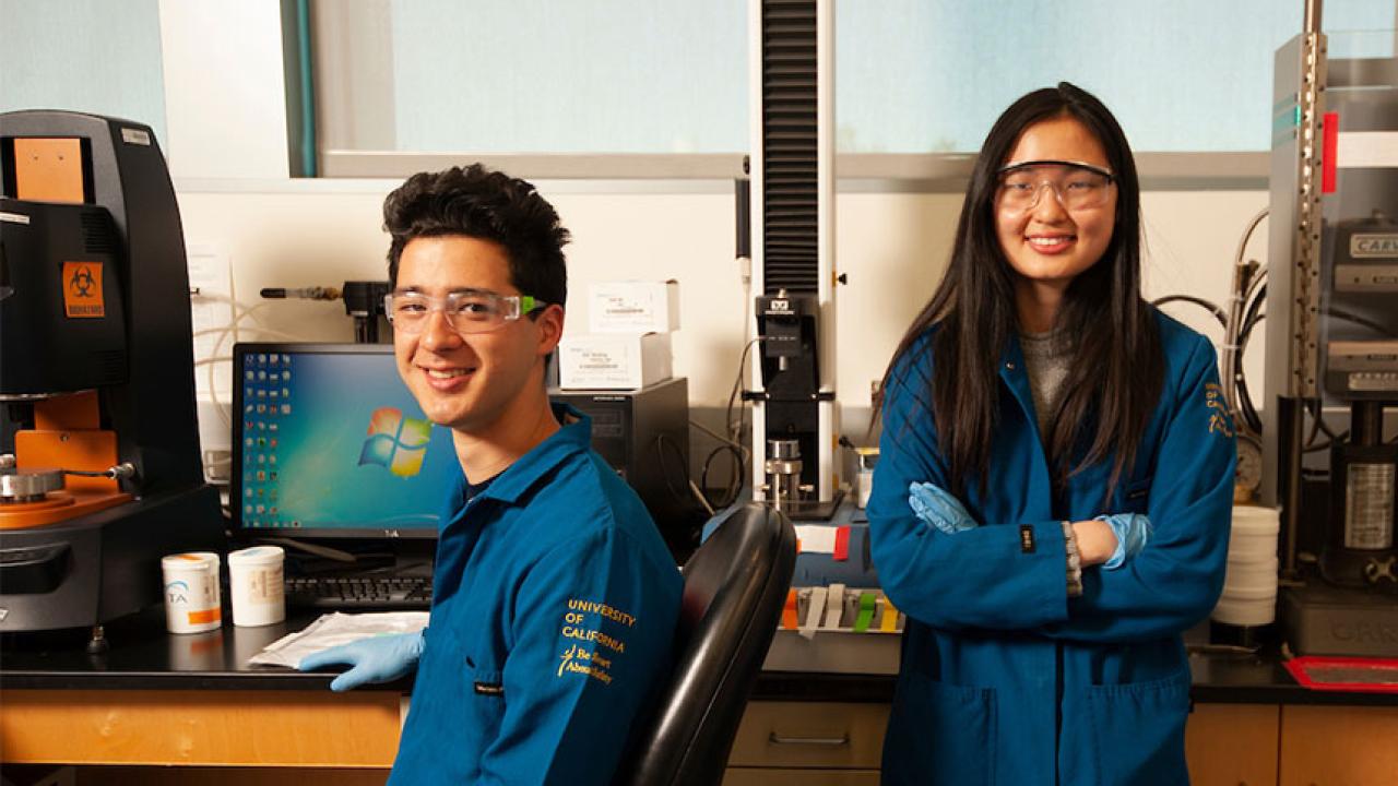 Two award winners in a science lab