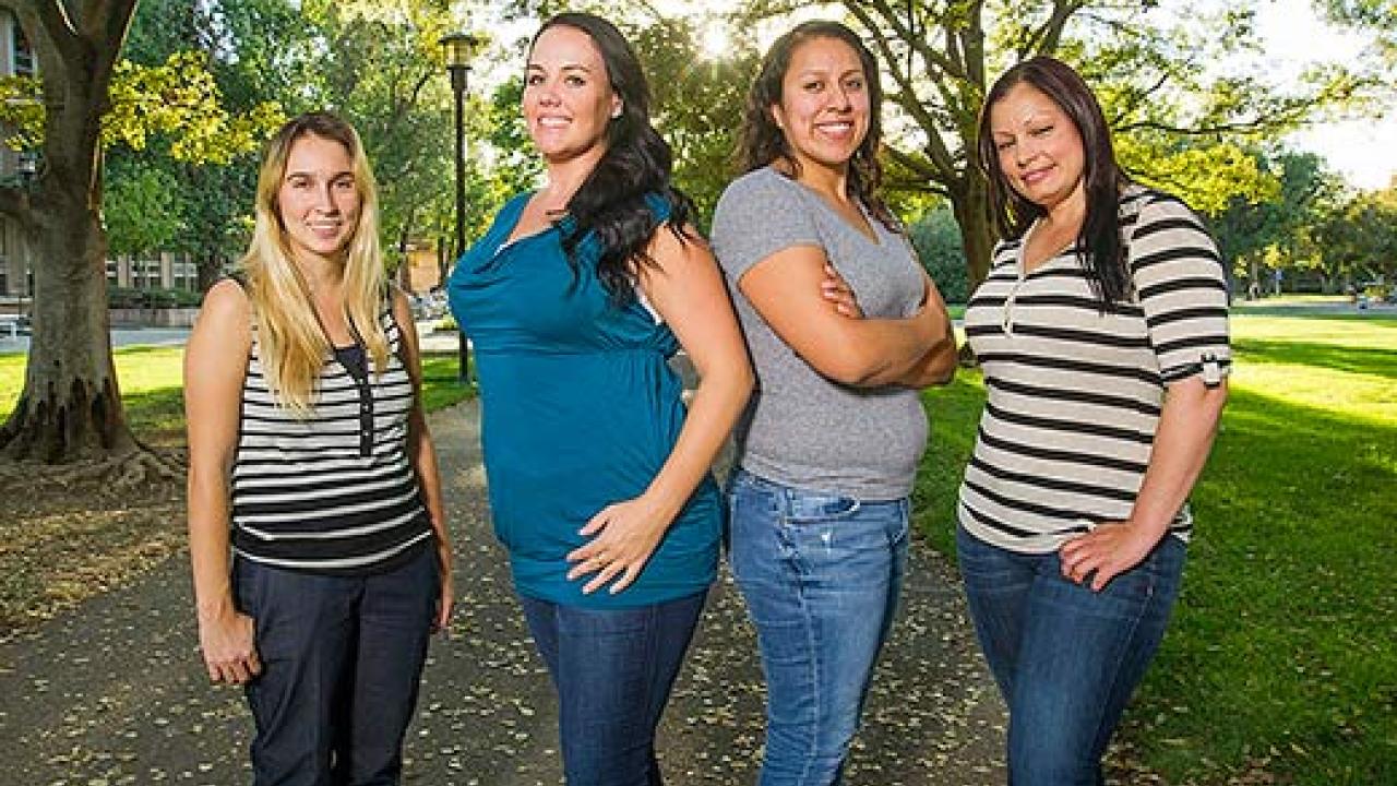 Four women standing in line for their photo