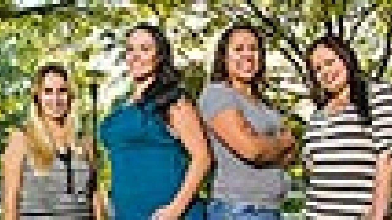 Four women standing outdoors