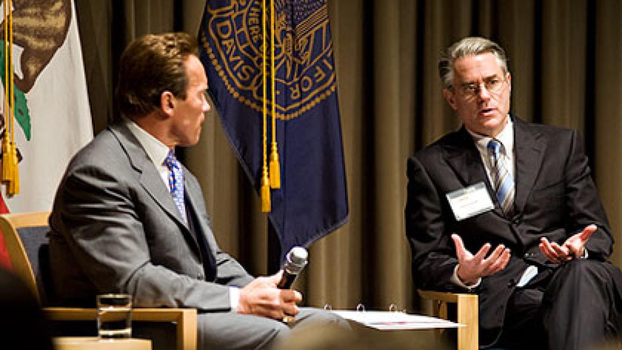 Photo: Gov. Arnold Schwarzenegger chats with GSM Dean Steven Curall 