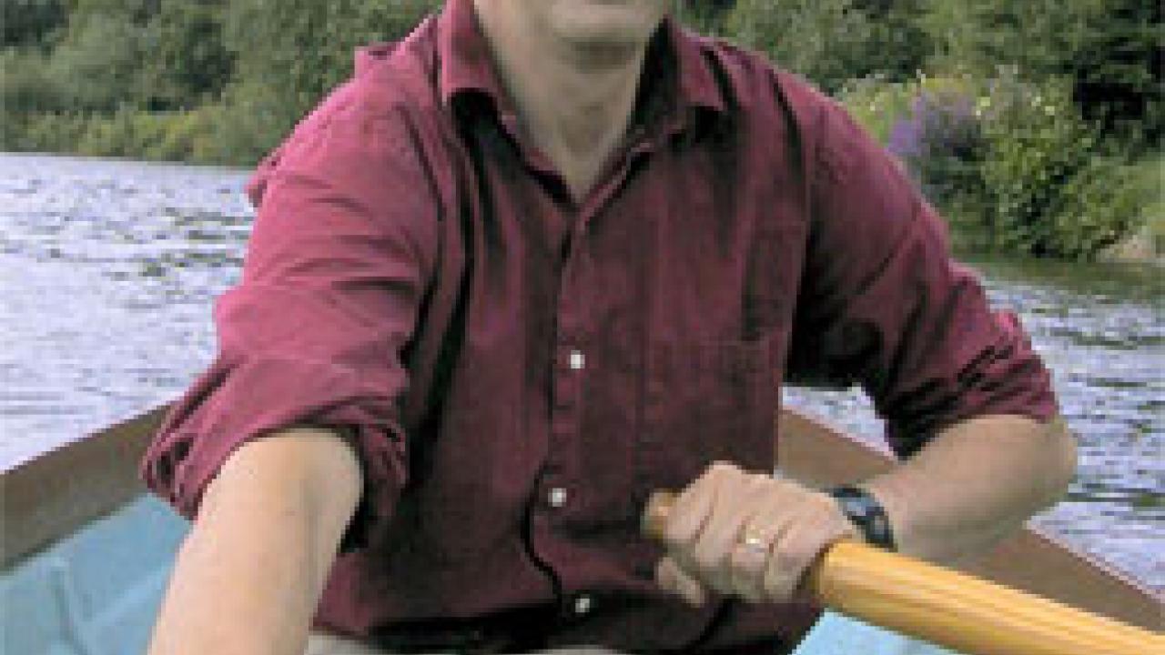 photo: man in row boat