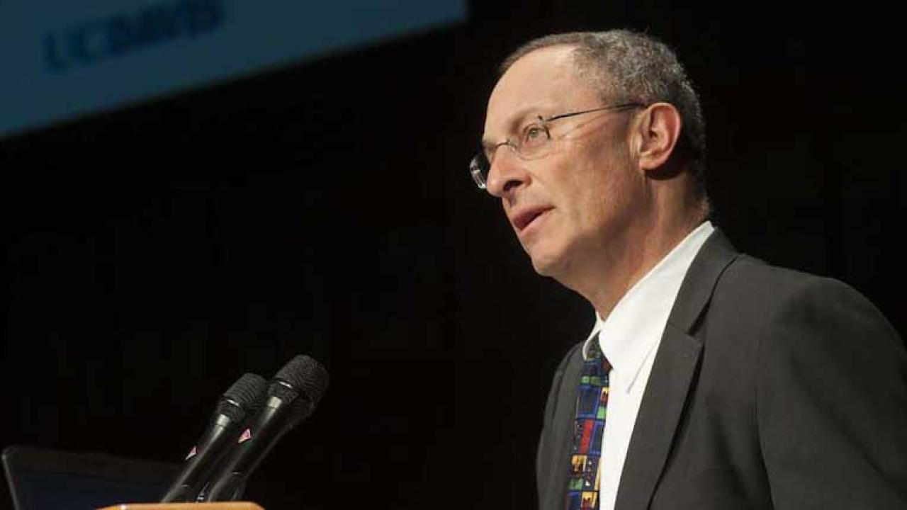 Photo: Interim Chancellor Ralph J. Hexter, at podium.