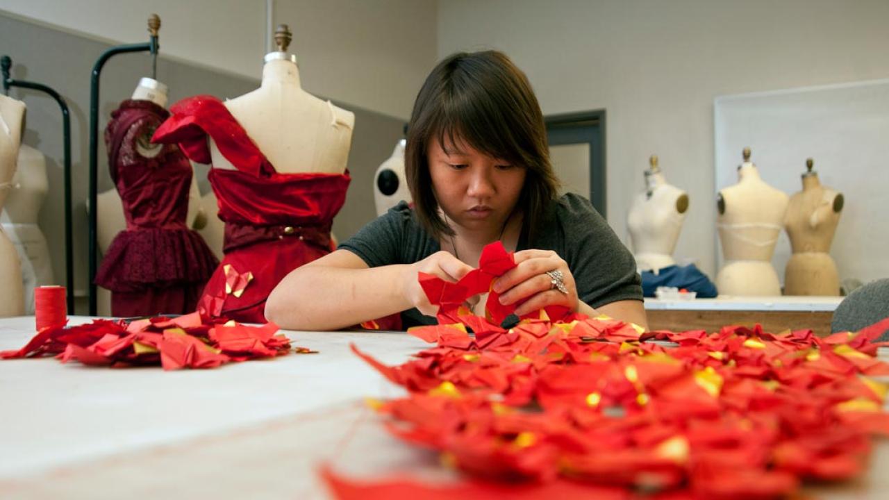 A student designs a dress