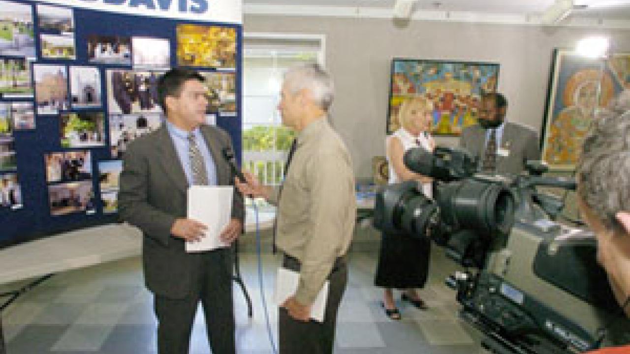 Paul Pfotenhauer interviews Enrique Lavernia for a NewsWatch spot on KVIE during Monday's press conference.
