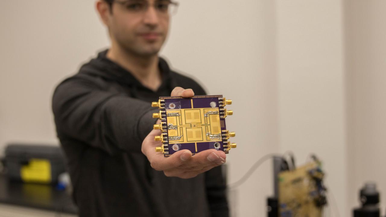 Student holding chip
