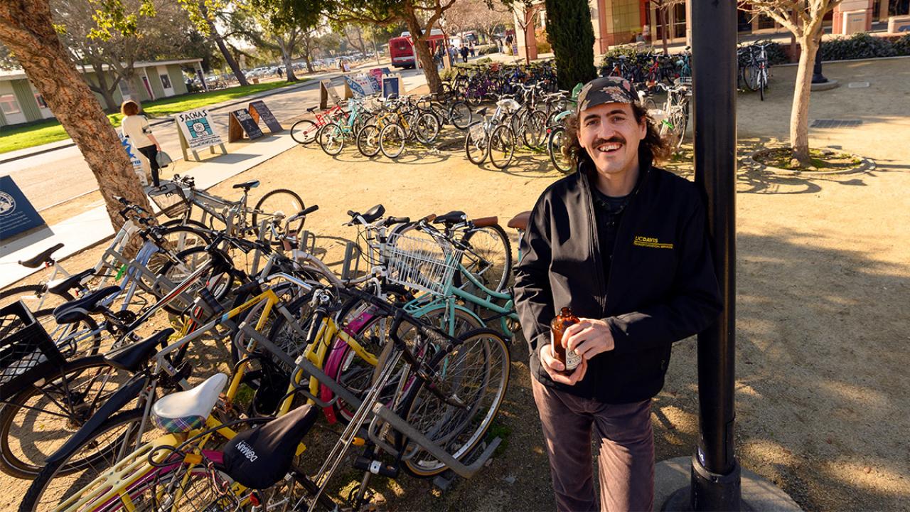 Photo of Jeff Bruchez among many bicycles.