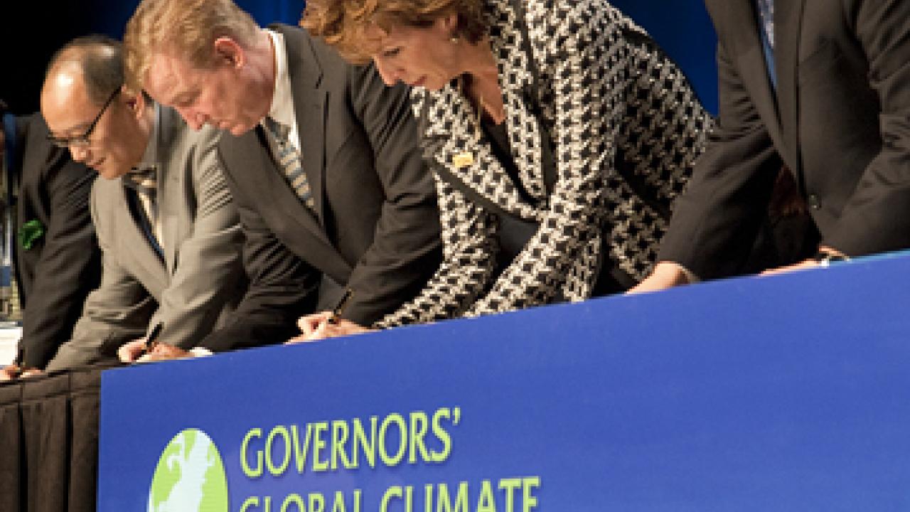 Photo: Linda P.B. Katehi and others signing at table