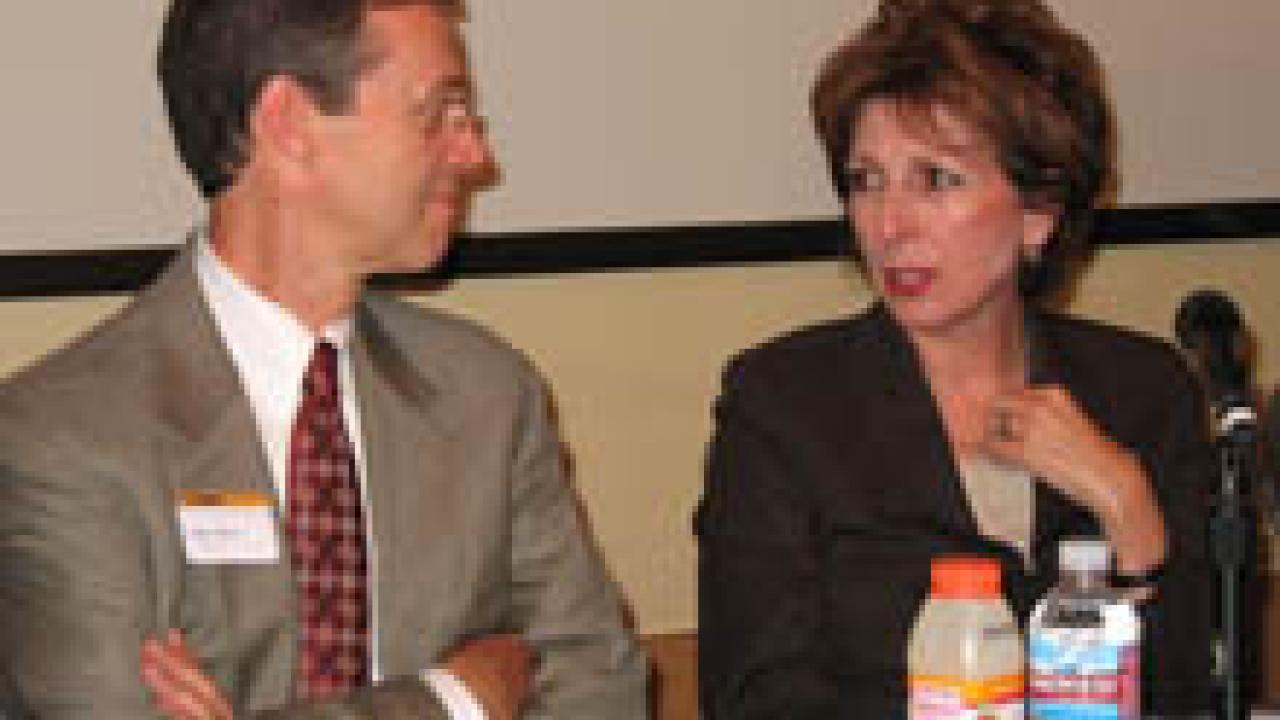 Chancellor Linda Katehi confers with Vice Chancellor John Meyer at the Oct. 15 Staff Open Forum. Katehi and other administrators spoke on the vision for the campus, budget updates and initiatives for 2009-10, furloughs and campus closure issues.