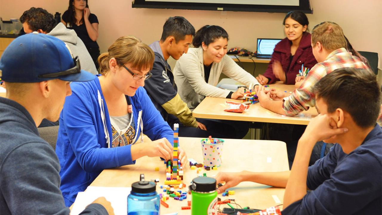 Students build Lego boats.