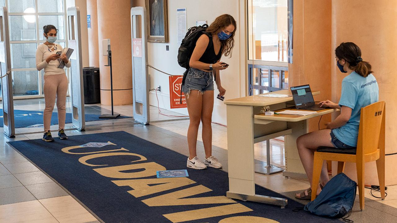 Students line up to enter the library.