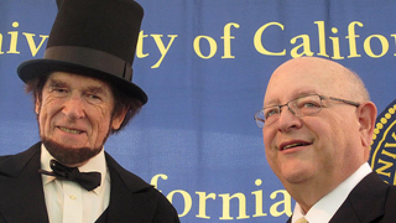 Man dressed as President Lincoln with UC President Mark Yudof