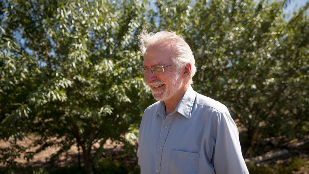 Marc Schenker in agricultural field
