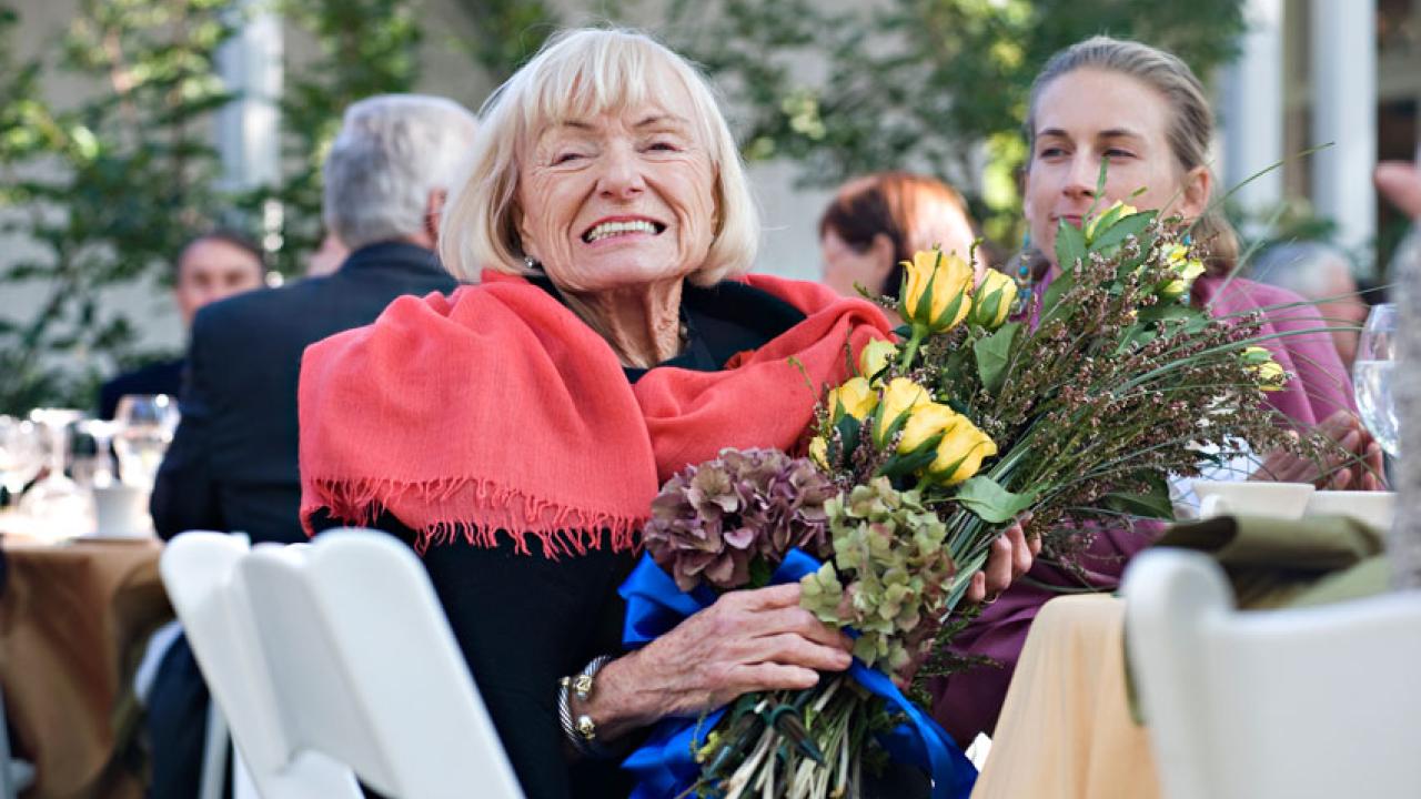 Photo: Margrit Mondavi holding bouquet of flowers