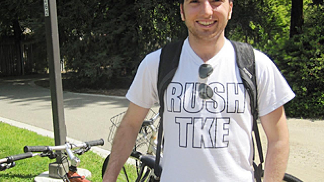 Man standing in T-shirt with backpack straps