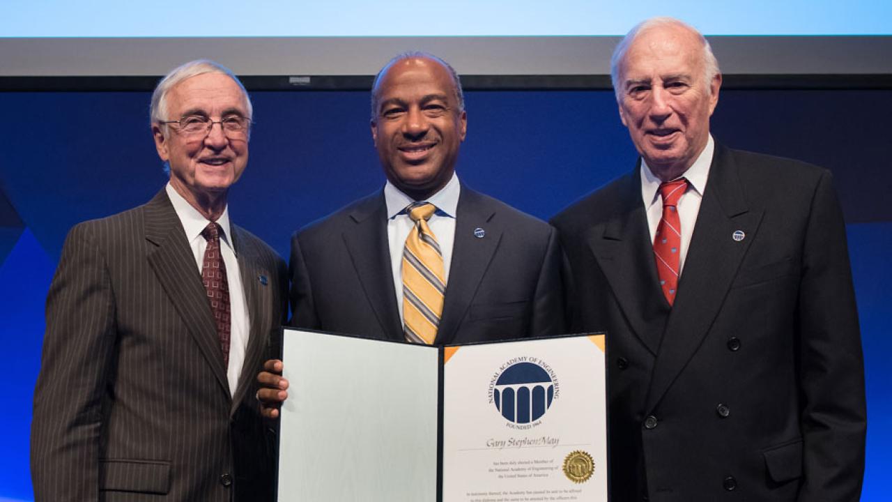 Chancellor May, holding certificate of membership in the National Academy of Engineering