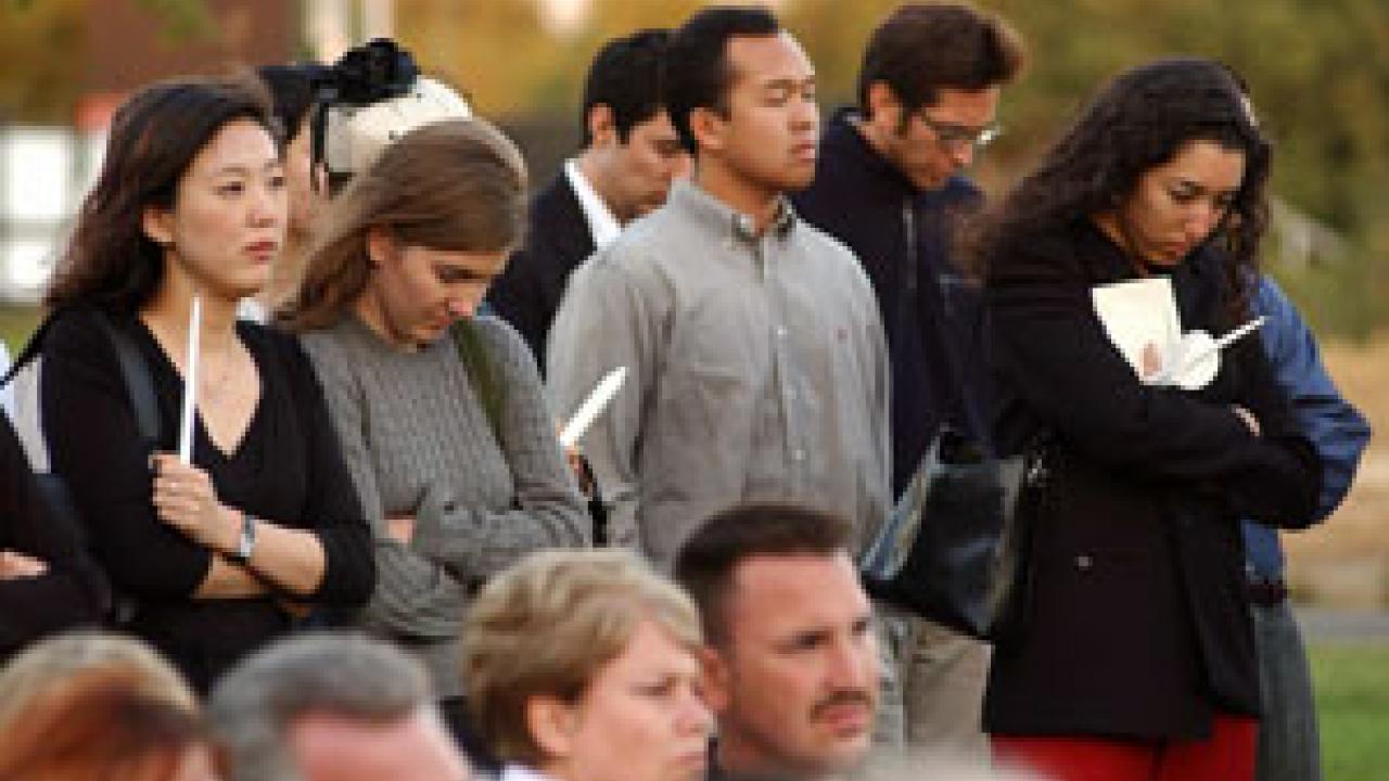 Medical students Jolene Chang, Alison Russell, David Law and Roxanne Aga join others in observing a moment of silence during last week&rsquo;s Donated Body Program memorial. Later, Danit Ariel of the class of 2007 takes part in the memorial tree-pla