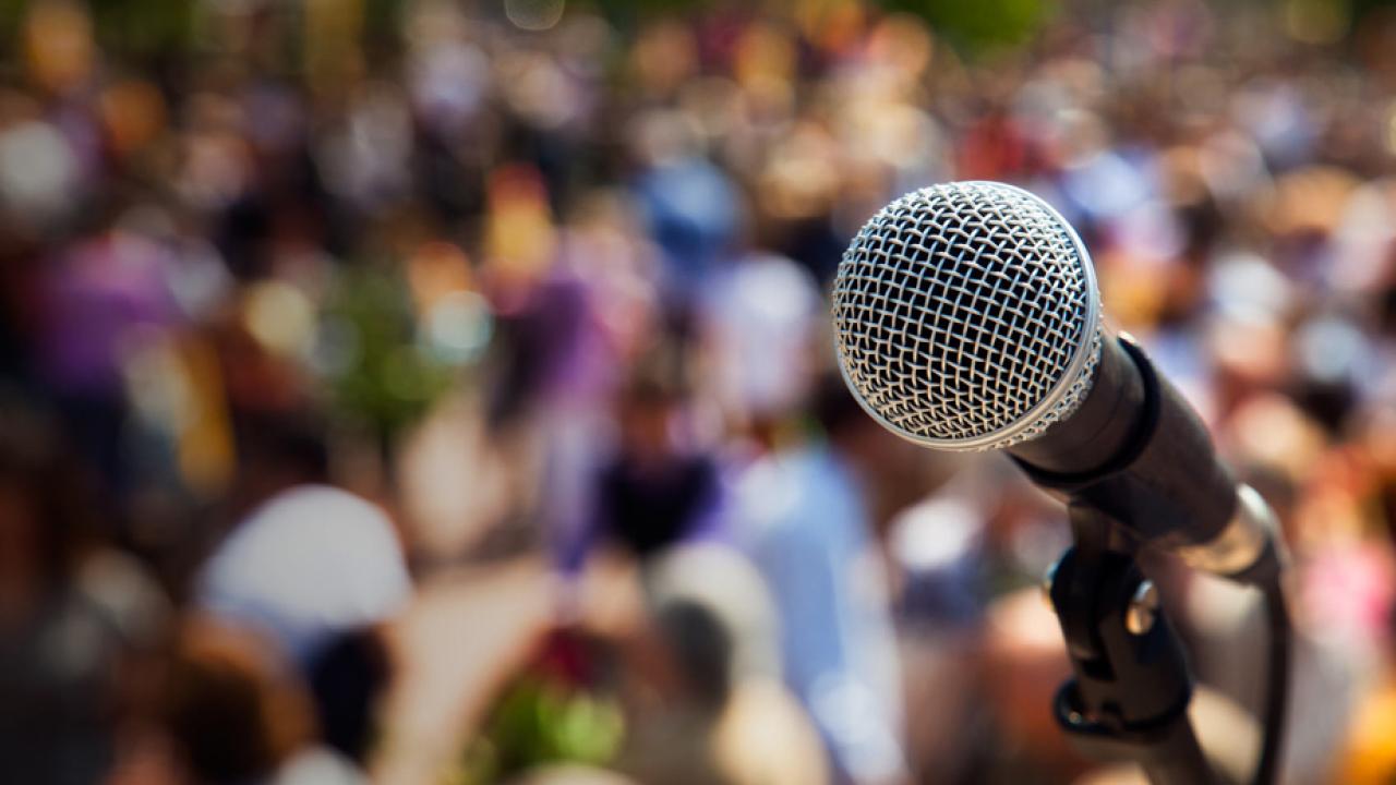 Microphone against backdrop of blurred crowd