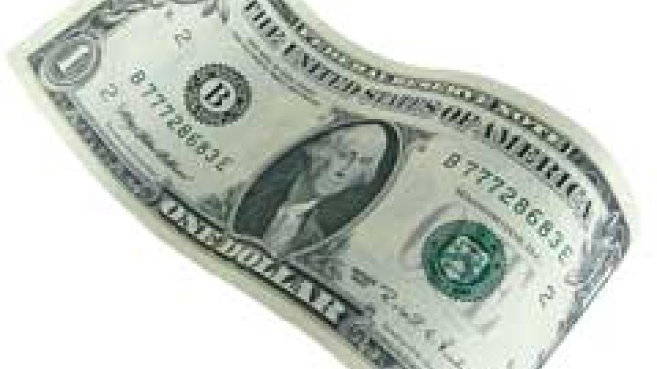 Photo: crumpled dollar bill