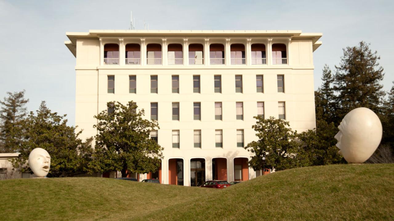 Photo: Mrak Hall exterior, two Eggheads in front (south side).