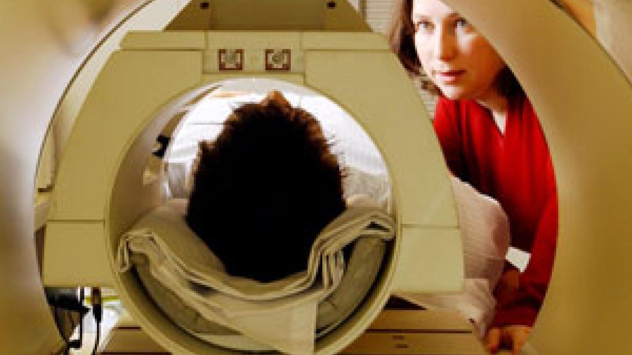 UC Davis assistant professor in psychology Susan Rivera gets a subject ready for a functional MRI scan. Functional magnetic resonance imaging represents the next step in MRI scans. It allows researchers to study changing  activity in healthy bra