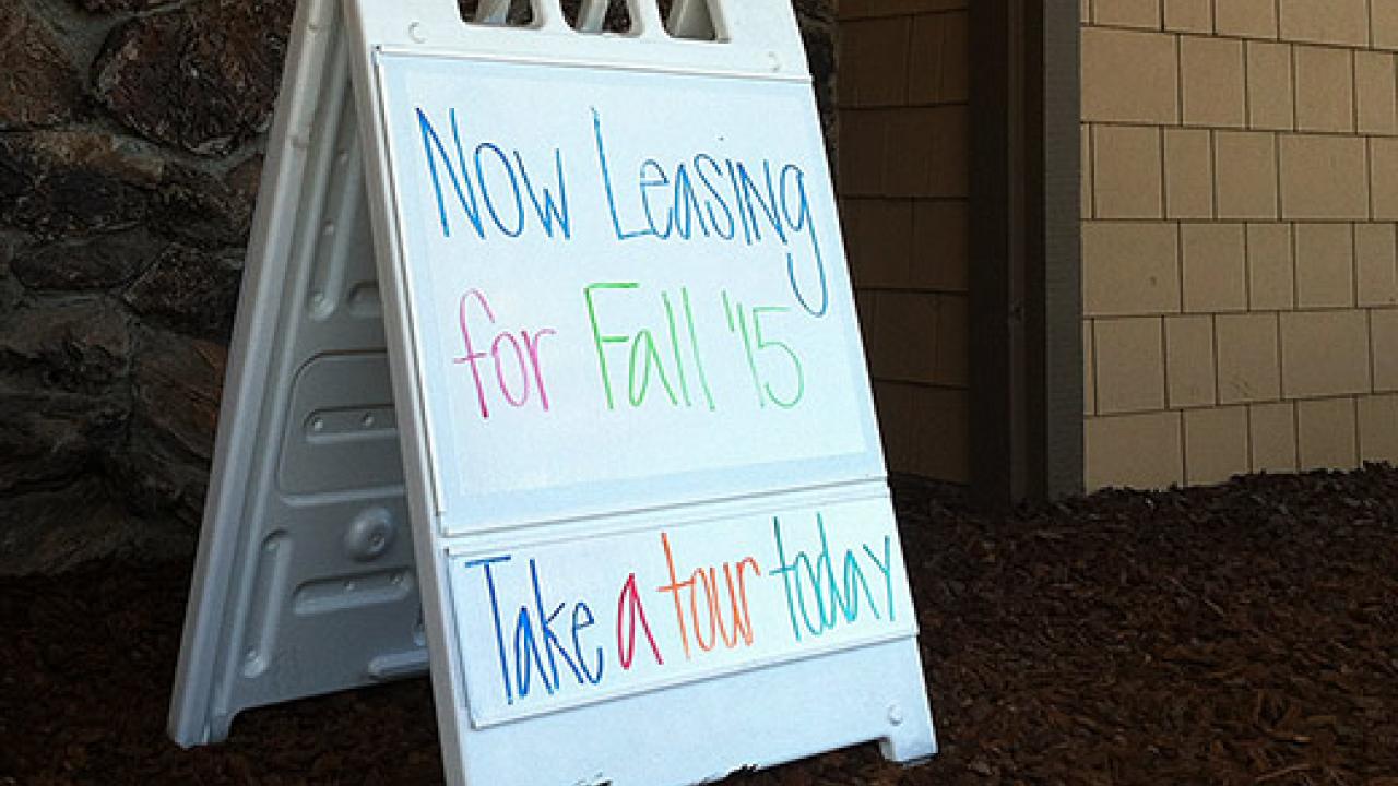 Sign saying "Now leasing for fall '16. Take a tour today."