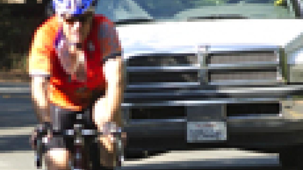 Photo: Bicyclist and truck share lane on Old Davis Road.