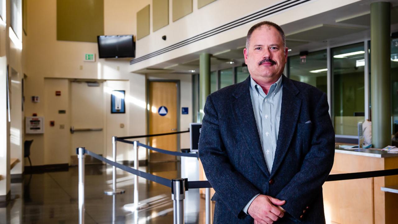 Perry Eggleston poses in lobby of TAPS Building.