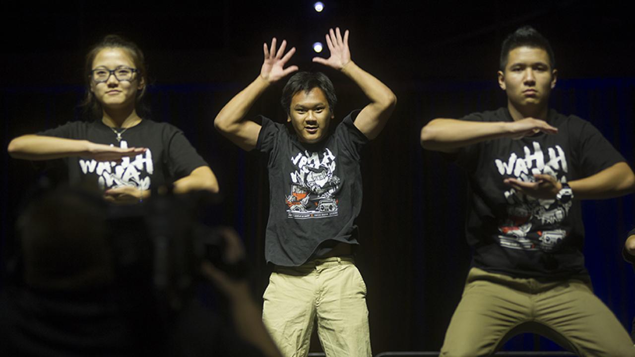 Photo: Three members of the Popping Club, dancing