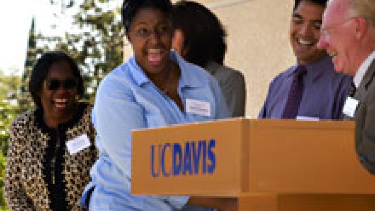 Freshman student Porch&Atilde;&iexcl; Chambers reacts as she shakes Chancellor Larry Vanderhoef&rsquo;s hand during a Sept. 21 ceremony in Sacramento honoring Chambers and four other students participating in the Reservation for College program.
