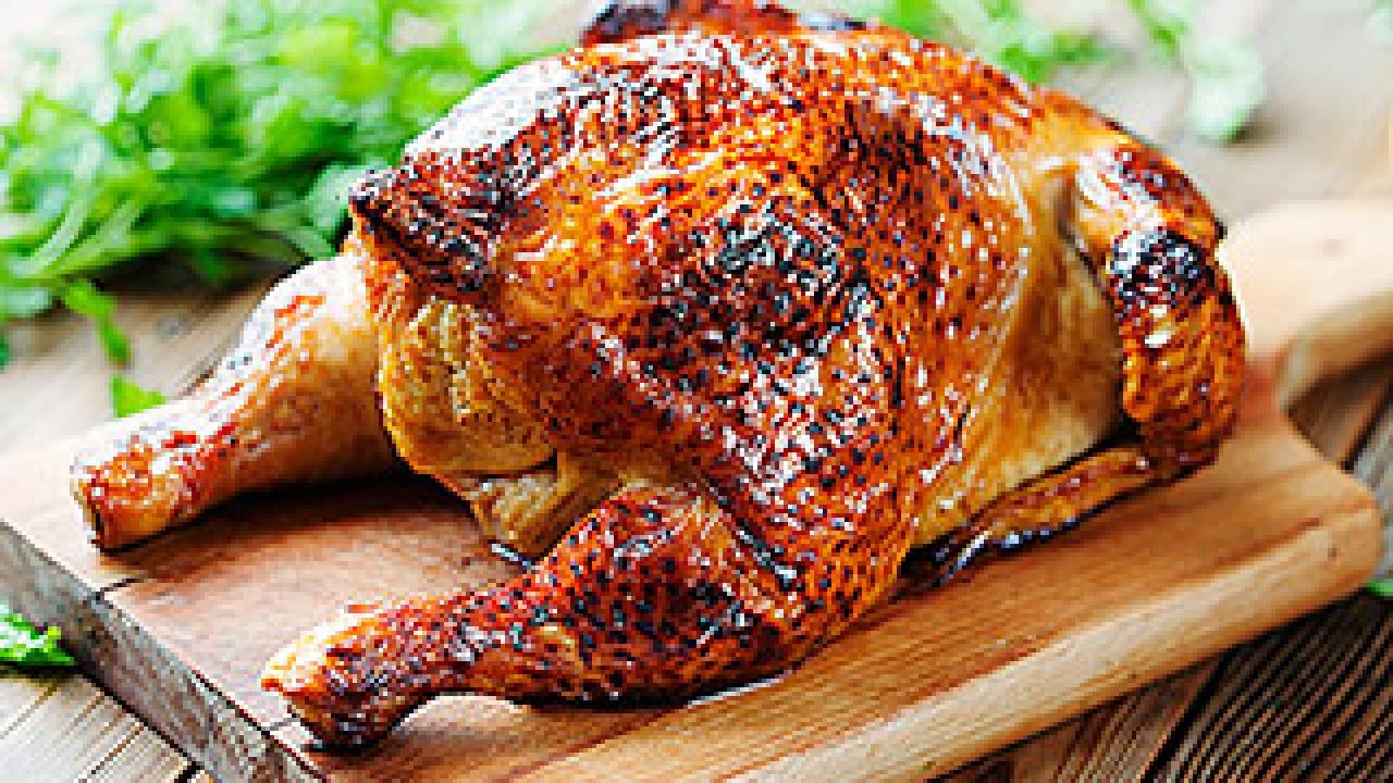 Roast chicken on a cutting board
