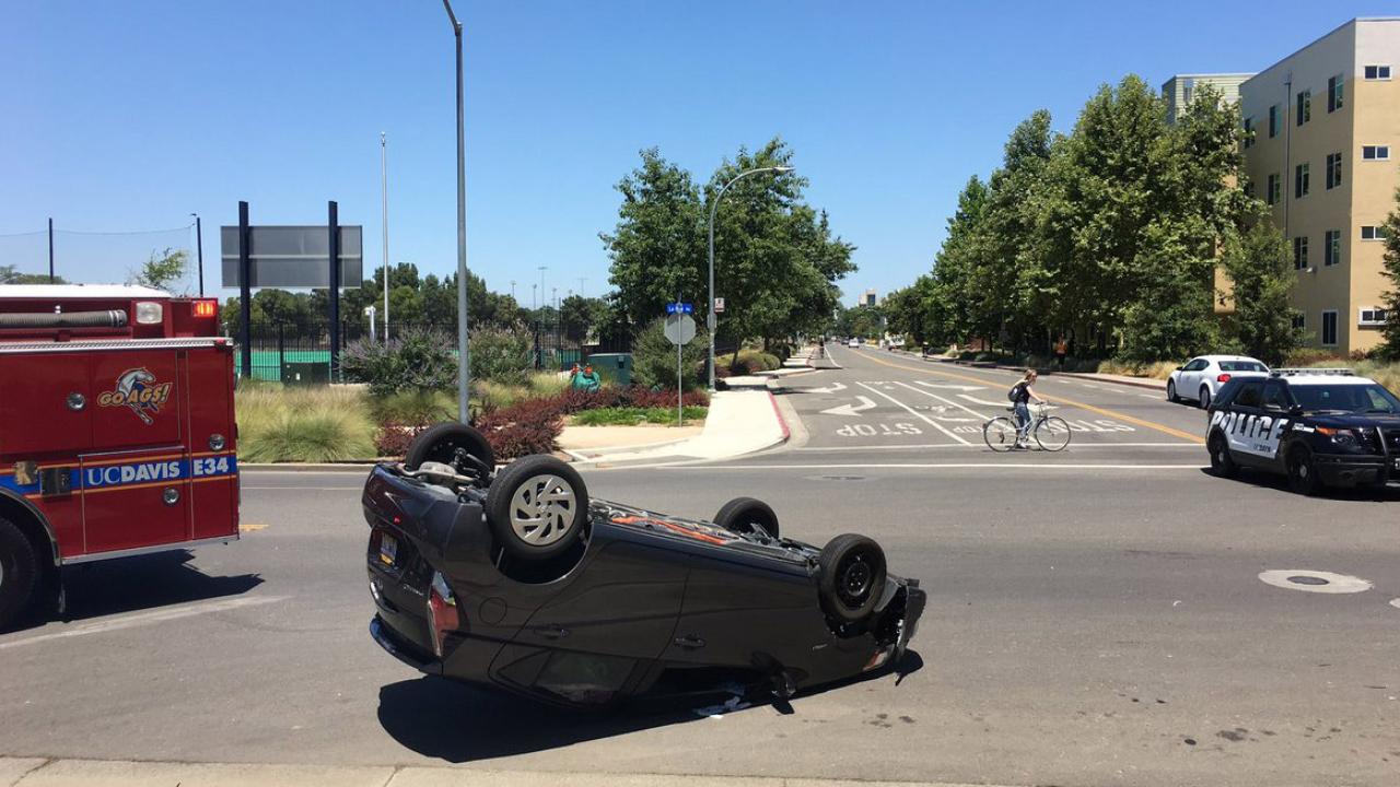 A rolled car at La Rue and Dairy roads.