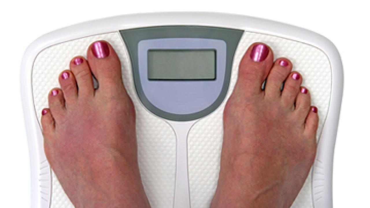 Photo: two bare feet on a scale