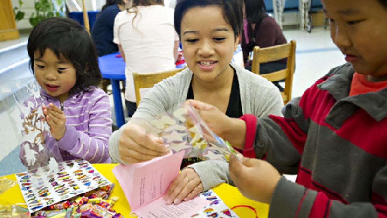 Photo: Trang Nguyen, a third-year textile and clothing major, volunteers during the Feb. 25-26 Weekend of Service.