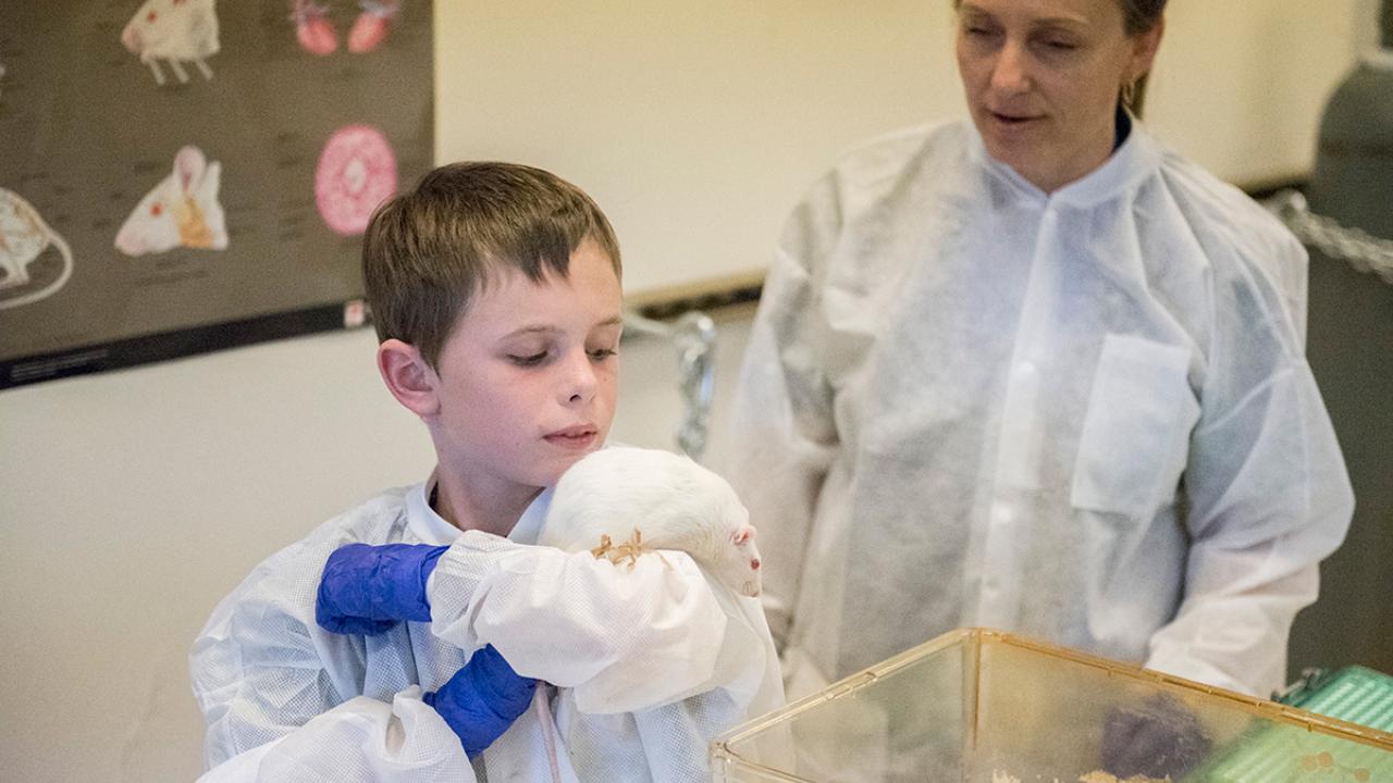 Photo: William Coates holds a rat.