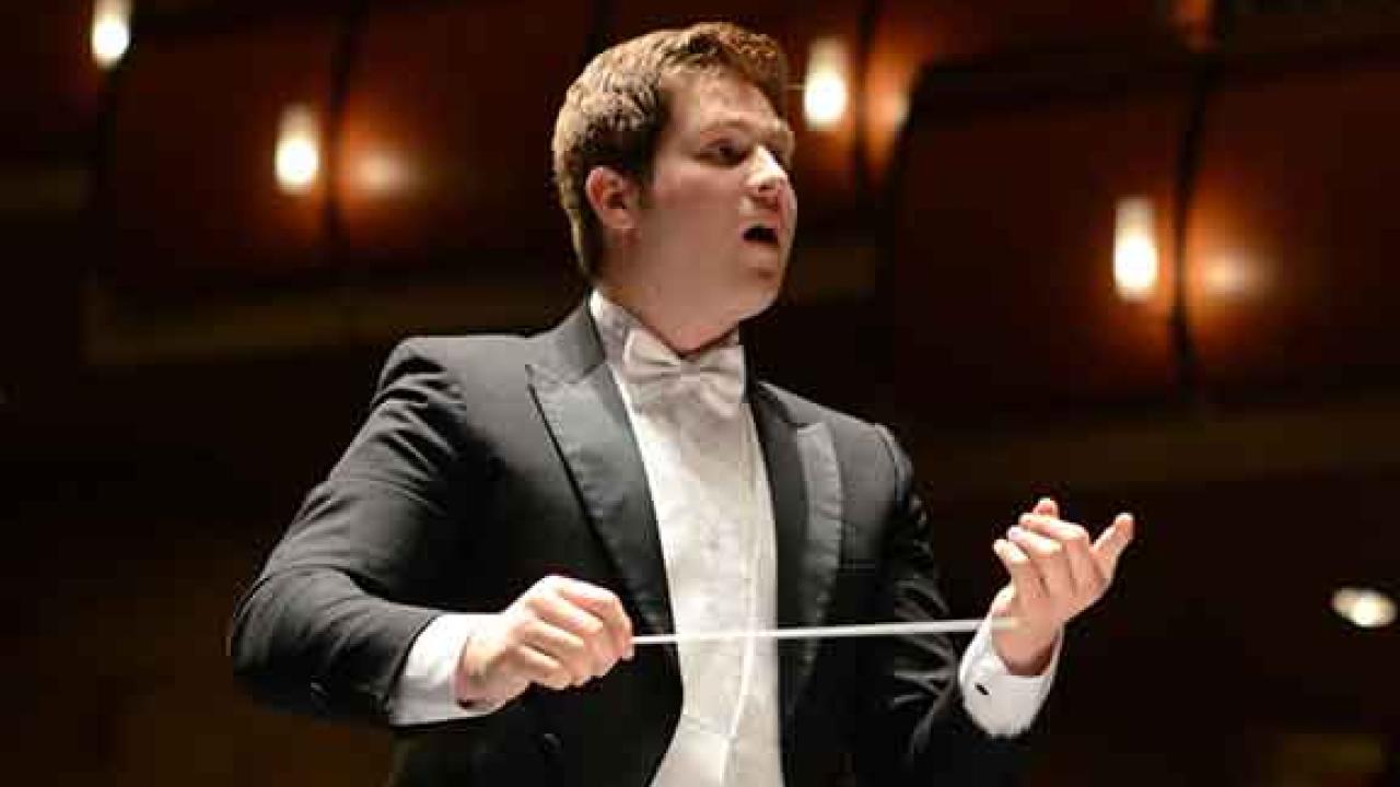 Photo: Student conductor Garrett Rigsby wields baton.