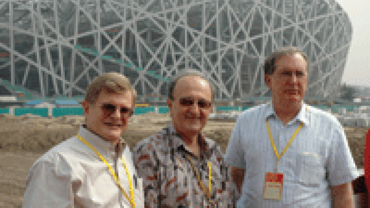 Food scientist Charles Shoemaker, right, was joined by former Aggies Richard Reidinger, left, and Robert Fontaine on a tour of the Olympic Games&rsquo; National Stadium in Beijing. Each was presented China&rsquo;s Friendship Award for contributing to Ch