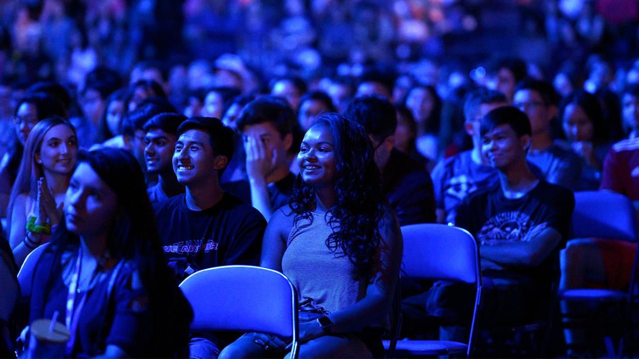 A crowd of students watches Fall Welcome.